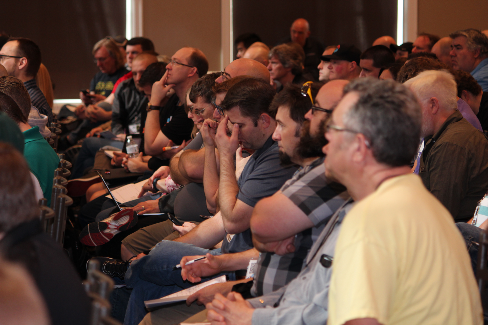 Attendees taking notes during a talk at Salt Lake City DevOps Days