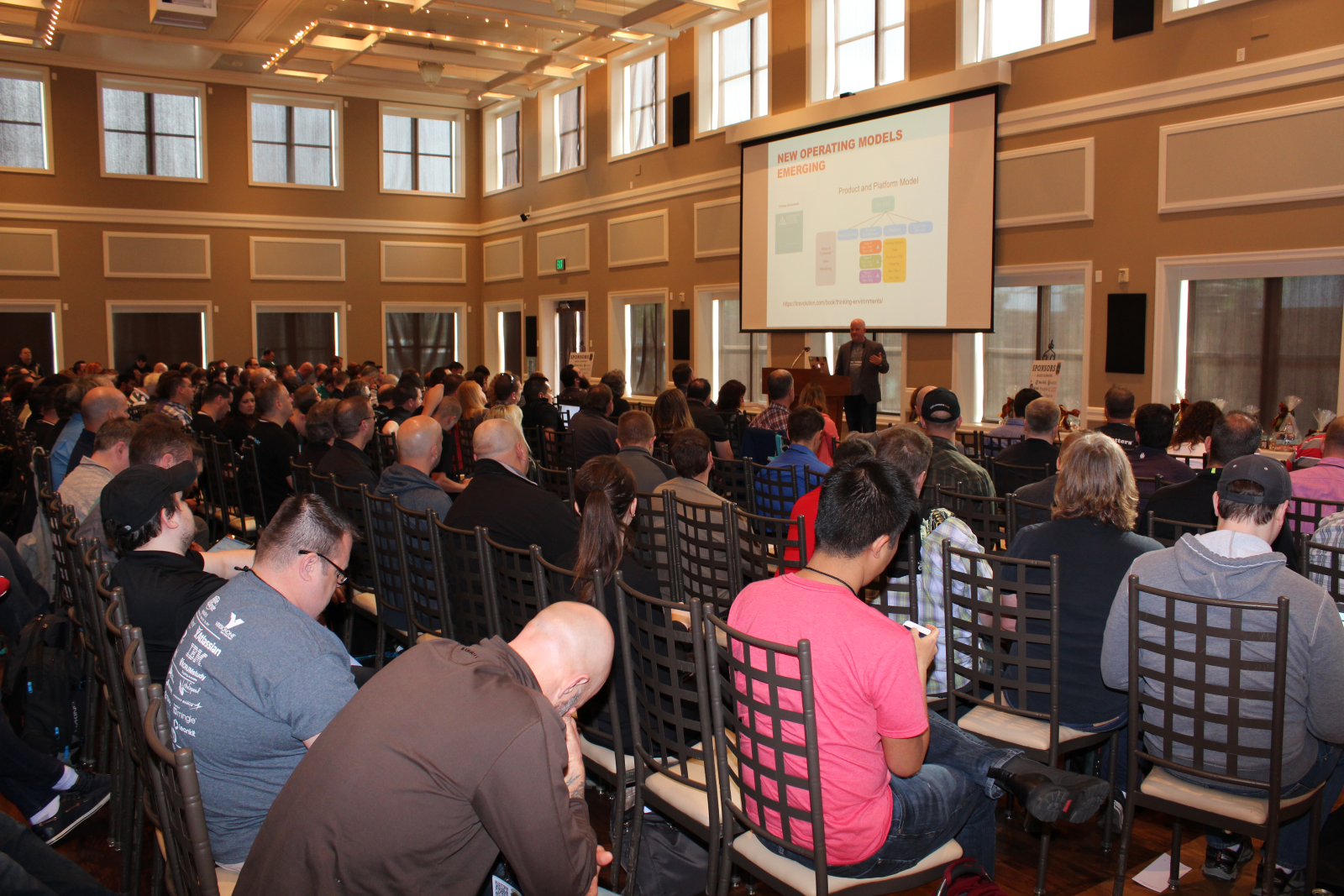 A speaker presenting to a full room at Salt Lake City DevOps Days